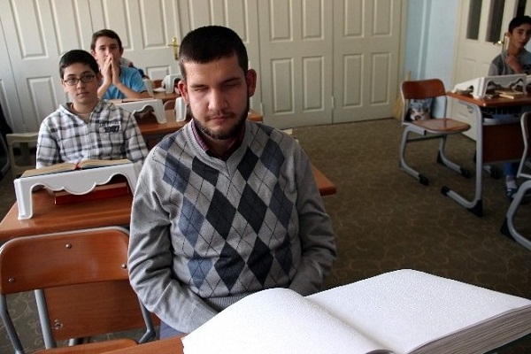 Turkish Blind Man Memorizes Quran Using Braille Copy