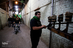 آیین مشعل گردانی نجفی‌های مقیم مشهد در شب تاسوعا‎
