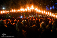 آیین مشعل گردانی نجفی‌های مقیم مشهد در شب تاسوعا‎
