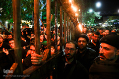 آیین مشعل گردانی نجفی‌های مقیم مشهد در شب تاسوعا‎
